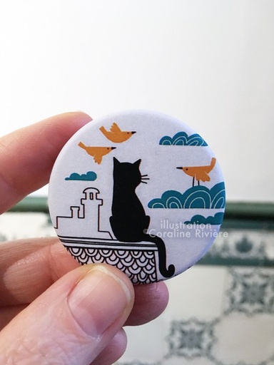 Coraï - badge chat sur le toit
